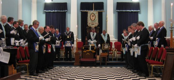 "From Labour to Refreshment": Members of Copthorne Lodge and their guests from other Surrey Lodges and from visiting French Lodges sing the "Closing Ode" at the conclusion of a meeting.